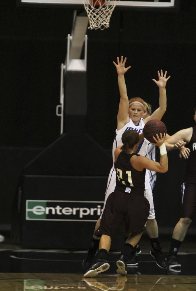 GVL / Robert Mathews / Breanna Kellogg (11) jumping to block an oppenents shot. 