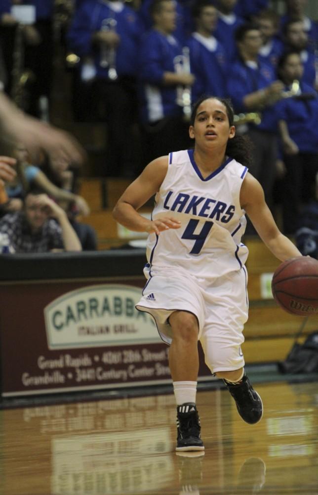 GVL / Robert Mathews / Jasmine Padin (4) taking the ball down court.