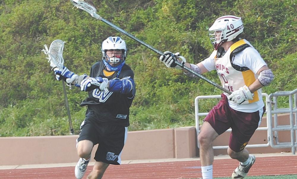 Senior attackman Jack Dumsa (left) battles a defender. Dumsa was nominated as one of four finalists for the Men