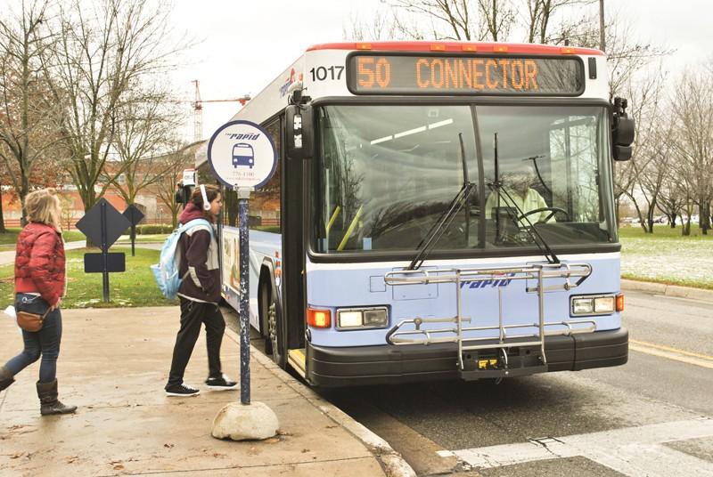 GVL/ Allison Young
Students step onto the Route 50 Campus Connector.  The Rapid, which operates the GVSU bus system, is considering replacing Route 50 with a new ‘Laker Line,’ which would extend further into Grand Rapids.

