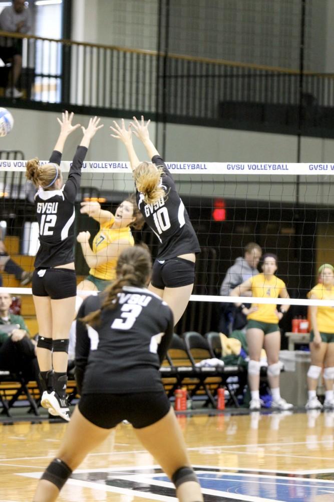 GVL Archive
Freshman Abby Aiken and sophomore Abby Ebels go up for the block during a past match. 