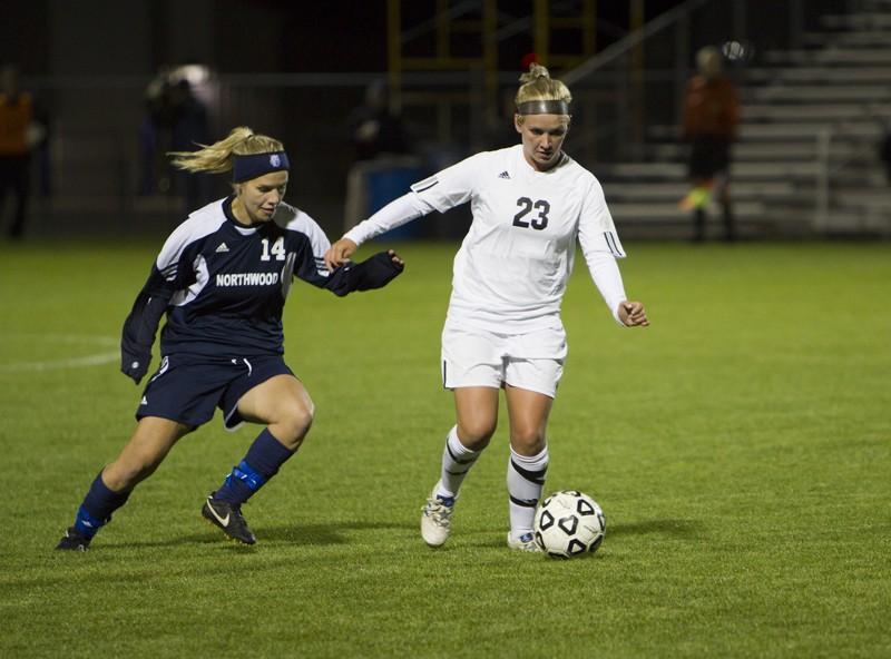 GVL Archive
Freshman forward Charlie Socia fends of her opponent during a past match against Northwood University.