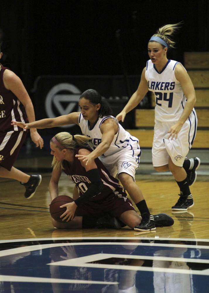 GVL / Robert Mathews / Jasmine Padin (4) hustles for a loose ball. 