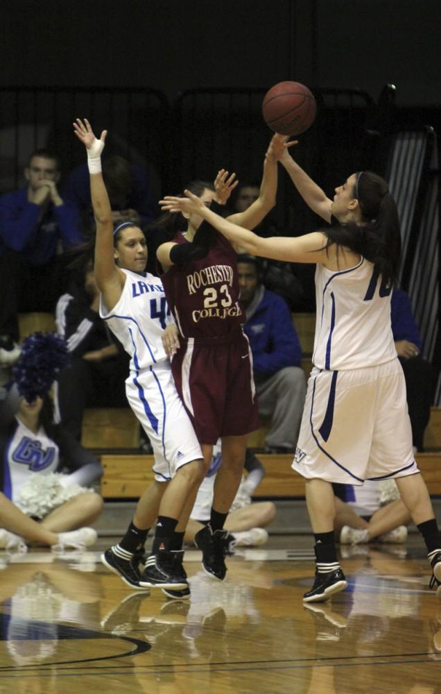 GVL / Robert Mathews / Forward Kellie Watson (10) and Guard Dani Crandall (44) stealing the ball from an opposing player. 