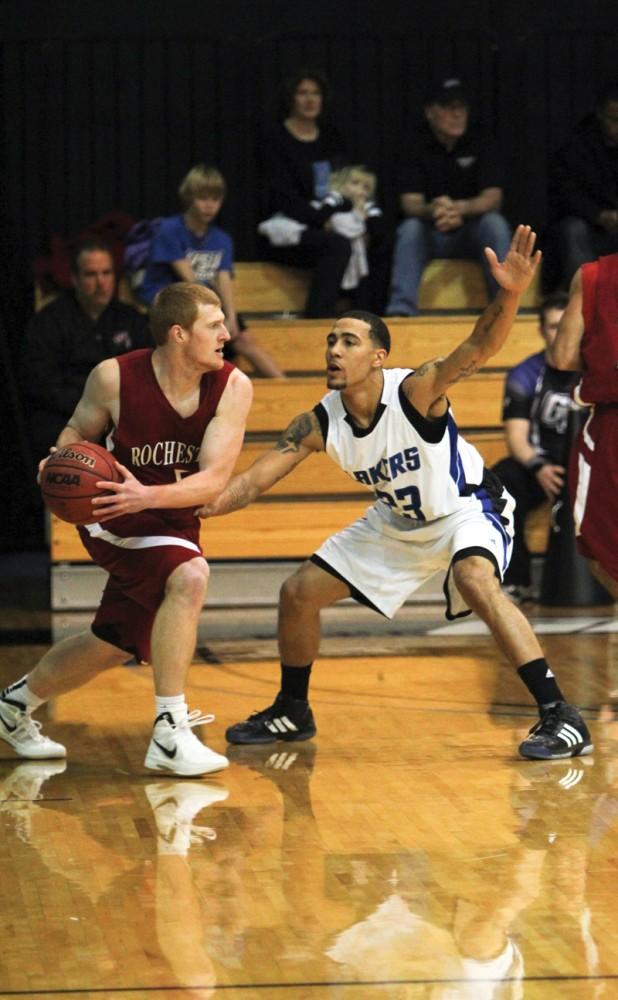 GVL / Robert Mathews
Senior guard James Thomas posting up against his opponent during Saturday's game against Rochester College. 