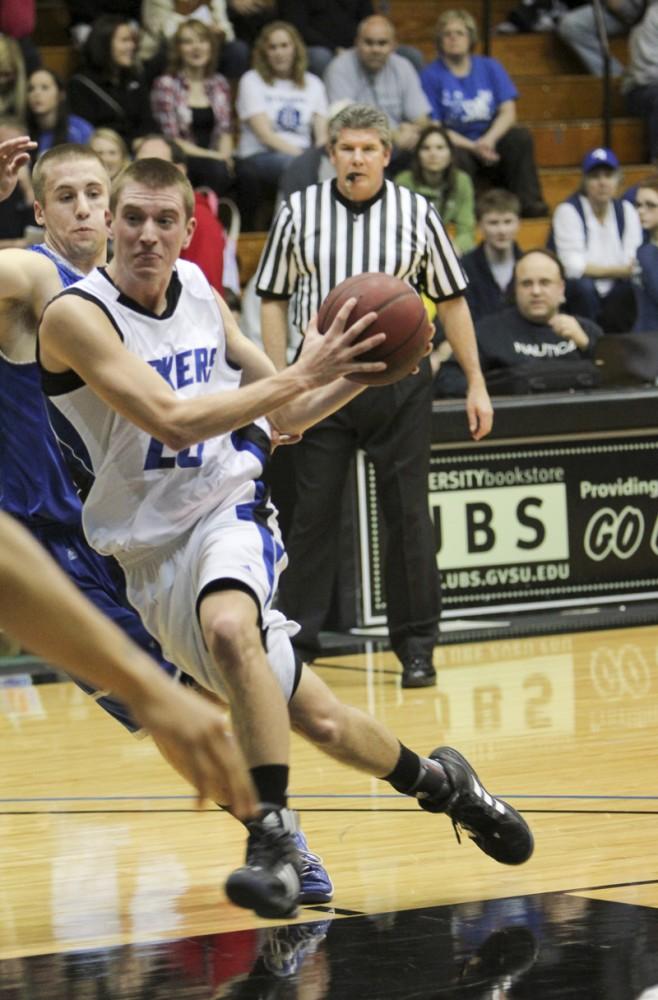 GVL / Robert Mathews
Freshman Ryan Sabin (20) drives the ball up the paint for a layup. Sabin finished with 6 points. 