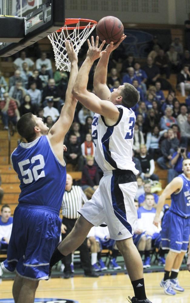 GVL / Robert Mathews
Mike Przydzial (32) goes up for a layup against a Hillsdale player. 