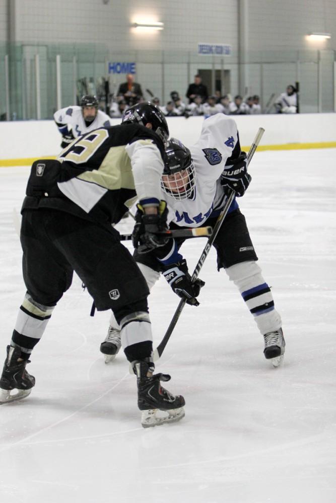 GVL / Robert Mathews
Freshman Ian Hamilton (4) prepares for a faceoff. The Laker hockey team took on D1 school Oakland University during their latest matchup. 