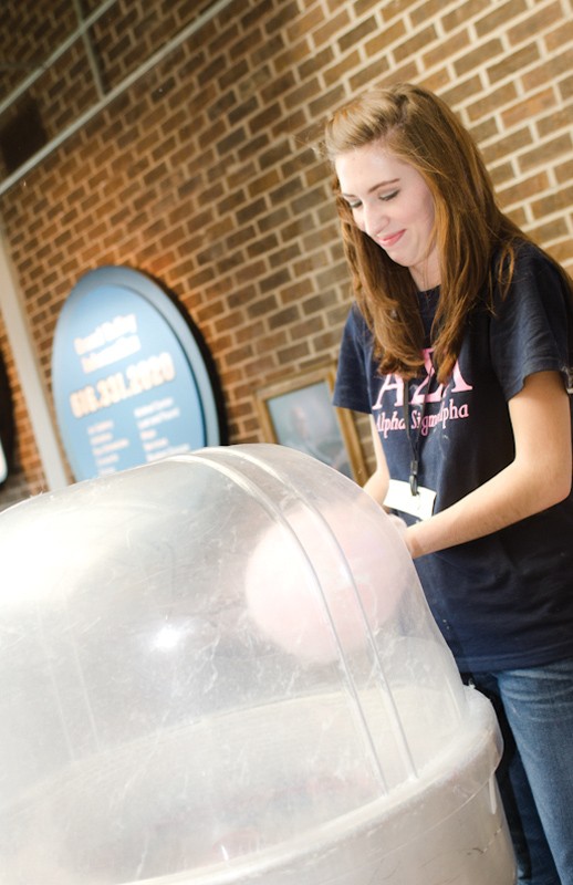 GVL / Bo Anderson
Taylor Keefer, a member of Alpha Sigma Alpha, makes cotton candy during Sibs &amp; Kids Weekend.