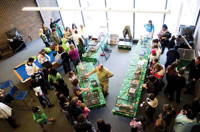 GVL / Bo Anderson
A birds eye view of the Sibs and Kids weekend crowd around the reptile exhibit in Kirkhof Center.