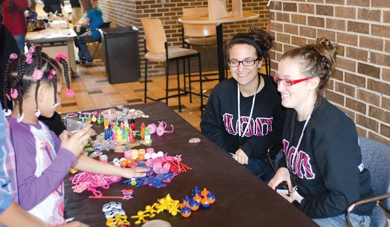 GVL / Bo Anderson
Jackie Gerhardy and Kayla Pollard work the prize table during Sibs and Kids Weekend.