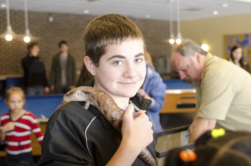 GVL / Bo Anderson
Jacob Wise, visiting Elizabeth Alley, a GVSU sophomore, at the reptile exhibit. 