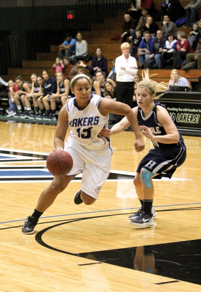 GVL / Robert Mathews
Junior Brittany Taylor (13) drives past a hillsdale player. B. Taylor scored 12 points and 10 rebounds in the Lakers 61-57 defeat. 