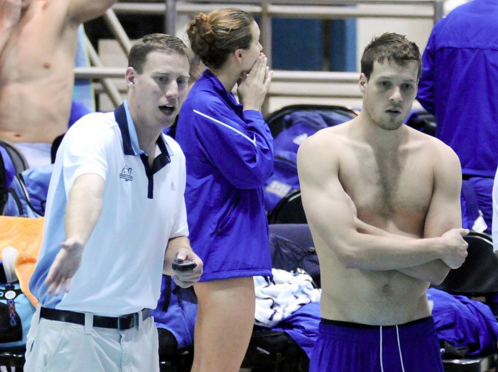 GVL Archive
Senior Aaron Beebe and Head Coach Andy Boyce discuss the race during a swim meet at home.