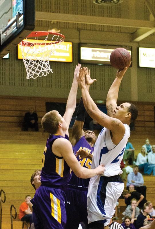 GVL / Archive 
Senior center Nick Waddell (2) goes up for a rebound during a previous game. 