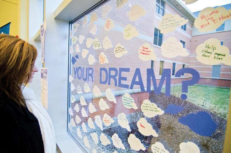 GVL / Bo Anderson

GVSU Junior Kristen Wellman looks at the Dream BIG display in Niemeyer. The Office of Fellowships Dream BIG campaign encouraged students to display their dreams on the clouds displayed.