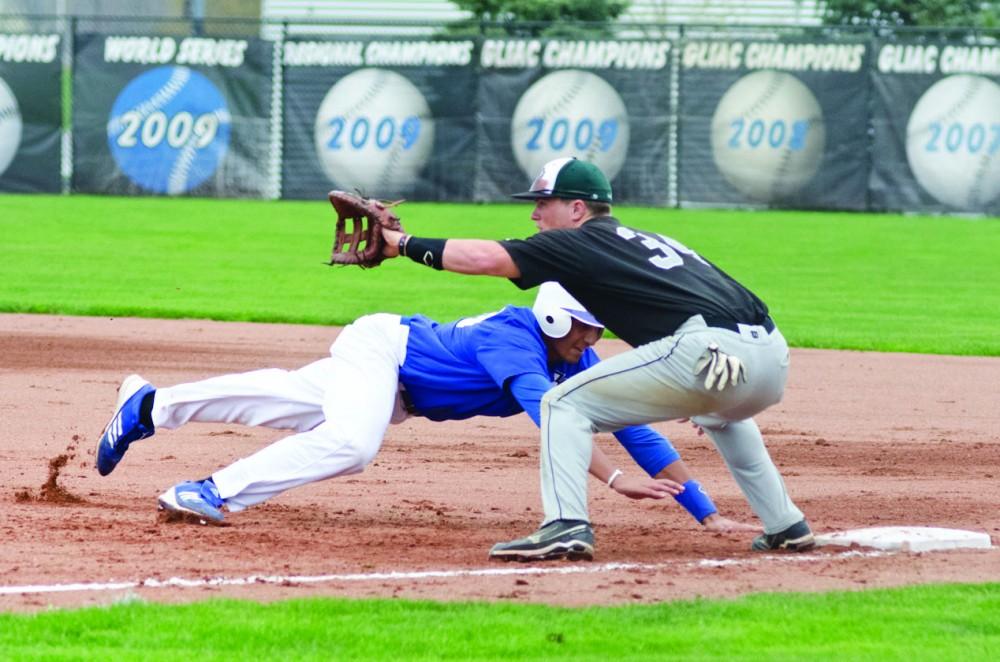 GVL / Bo Anderson

GVSU Infielder Giano Brugnoni dives back safely into first base.