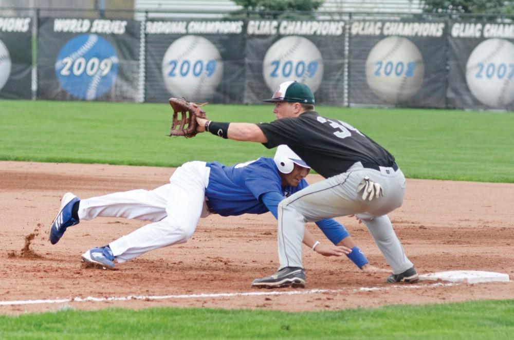 GVL / Bo Anderson

GVSU Infielder Giano Brugnoni dives back safely into first base.