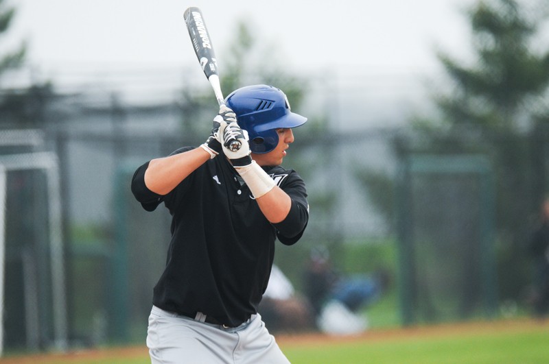 GVL / Robert Mathews
Senior Cory Baker (20) pitching against Northwood University. 