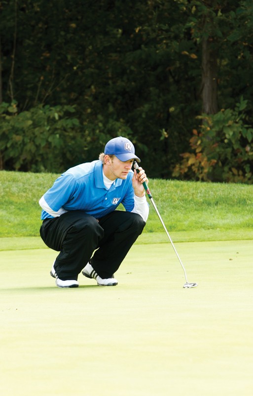 GVL / Archive
Senior golfer Travis Shooks lining up for a putt.