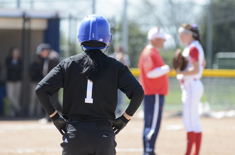 GVL / Bo Anderson

GVSU's Nellie Kosola looks on as SVSU's coaching staff meets with the pitcher on Saturday.