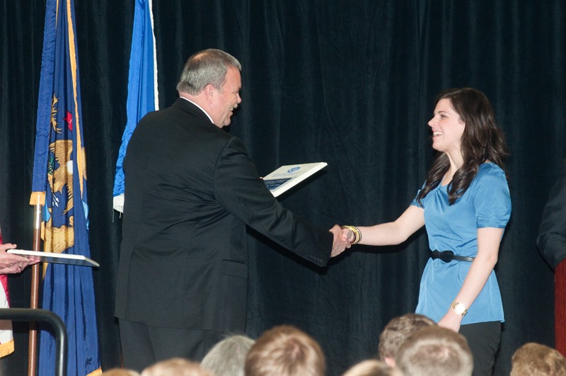 Courtesy Photo / News and Information Services 
Senior Natalie Cleary accepts an award from Dean of Students Bart Merkle