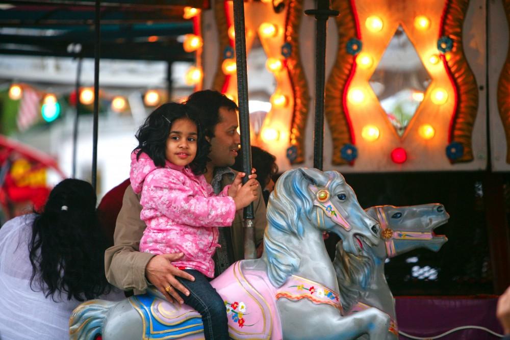 GVL / Eric Coulter
A young child and her father enjoy the attractions at the Holland Tulip Time Carnival