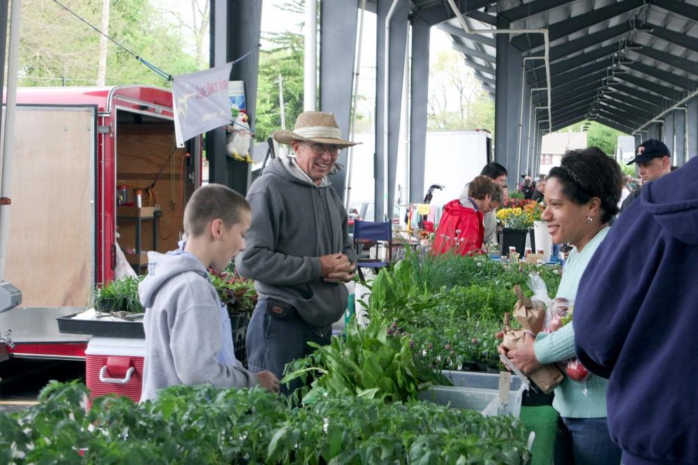 GVL / Eric Coulter
Len Goodells and his Grandson Avory run the table of Goodells Farm at Fulton Street Farmers Market. 