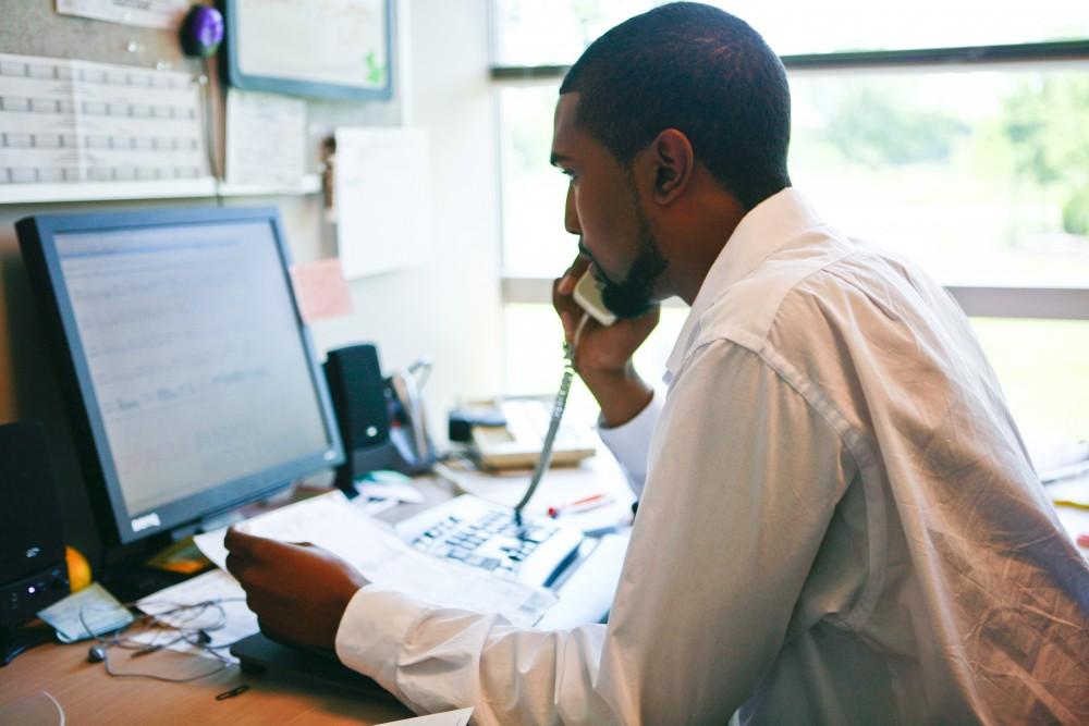 GVL / Eric Coulter
Financial Aid Counselor Detwann Johnson helps a student over the phone 