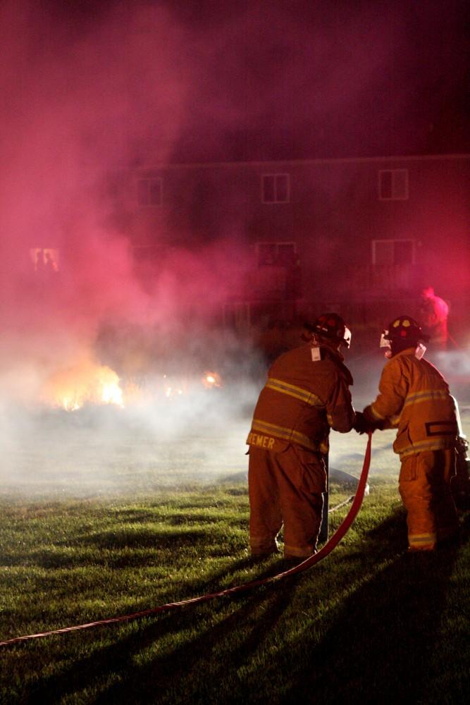 GVL / Eric CoulterAllendale Firefighters put out a grass fire in Hillcrest Apartments caused by the misuse of fireworks