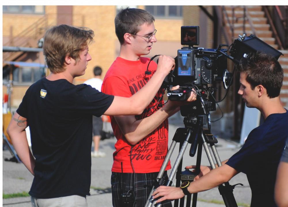 	Grand Valley State University film and video production majors work with the camera on the set of this years’ GVSU Summer Film Series short film, “Realizism.” 