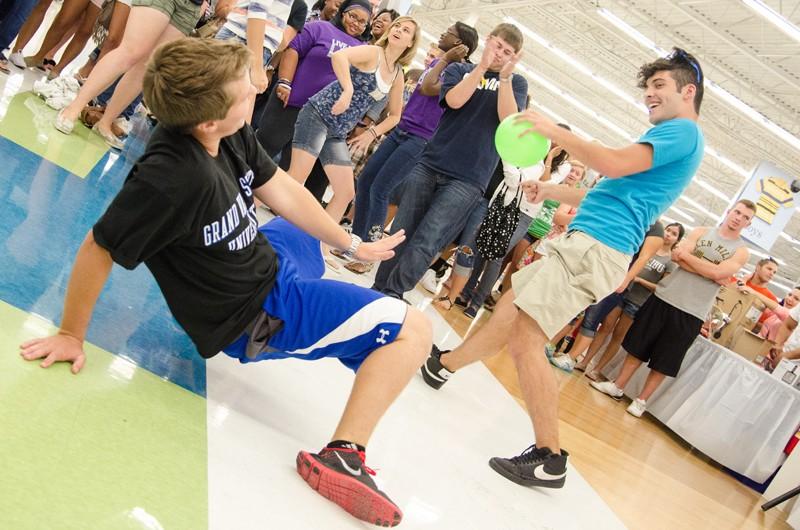 GVL/Bo Anderson Dustin Schonhard and Andy Harring lead the crowd at Meijer Mania on Tuesday evening in Standale.