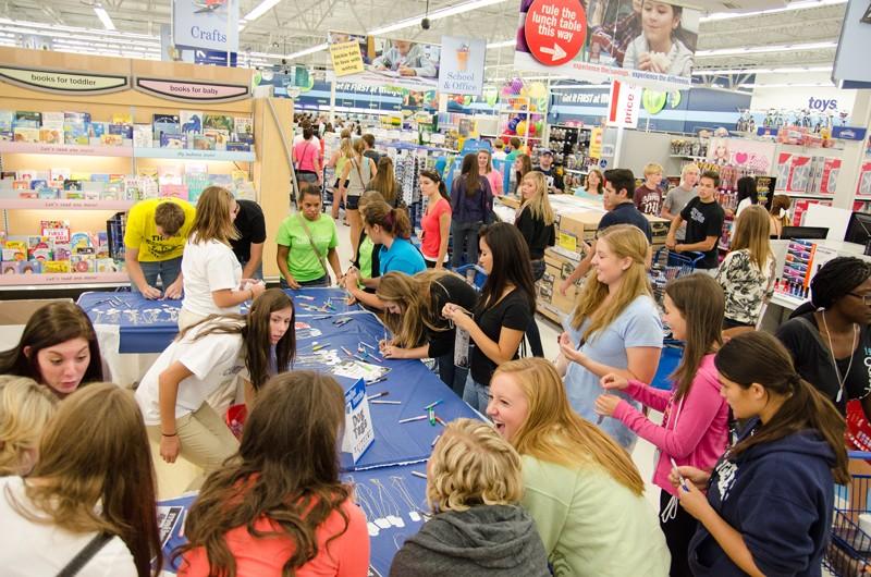 GVL/Bo Anderson GVSU students line up to create dogtags at Meijer Mania on Tuesday.