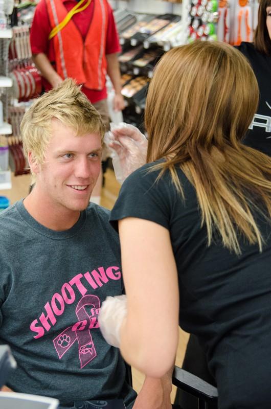 GVL/Bo Anderson Jared Stuyuesant gets some styling tips from the Axe stylists at Meijer Mania.