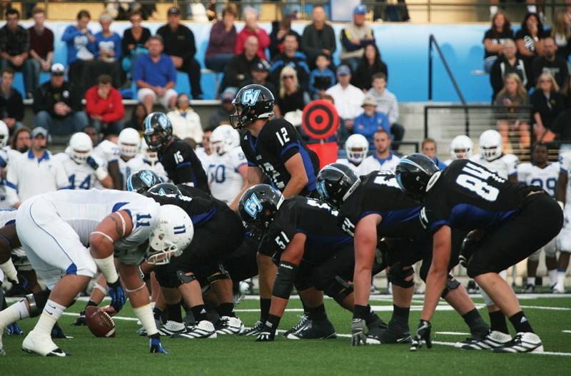 GVL / Robert Mathews 
Quarterback Heath Parling (12) leading the offense past Notre Dame College. 