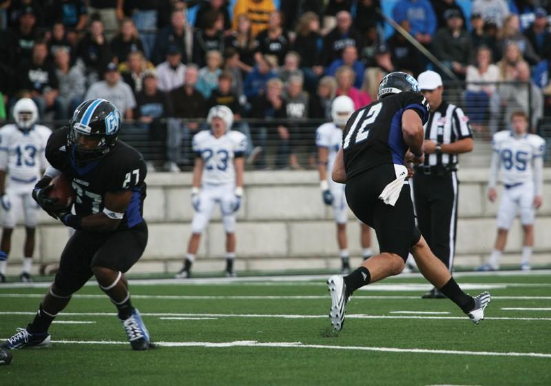 GVL / Robert Mathews 
Heath Parling (12) passing the ball off to Kirk Spencer (27).