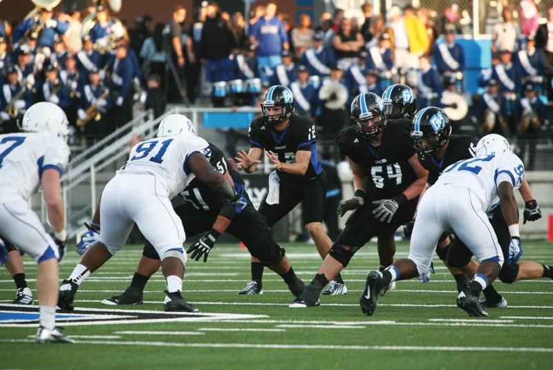 GVL / Robert Mathews 
Quarterback Heath Parling (12) leading the offense past Notre Dame College.