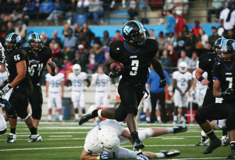 GVL / Robert Mathews 
Chris Robinson (3) rushing past defenders against Notre Dame College. 