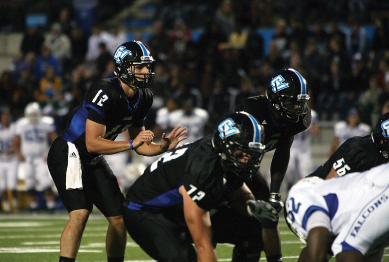 GVL / Robert Mathews 
Quarterback Heath Parling (12) leading GVSU against Notre Dame College.