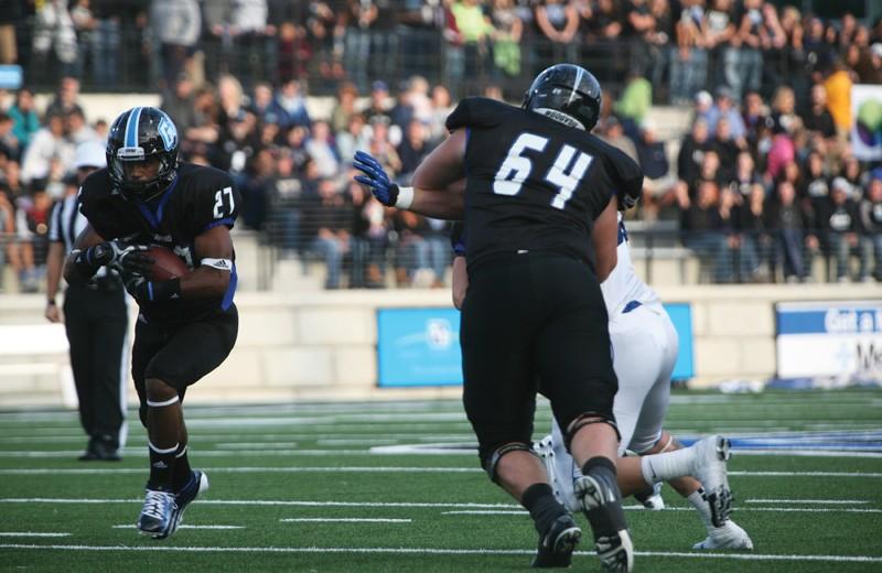 GVL / Robert Mathews
Freshman running back Kirk Spencer (27) speeding past a defender. 