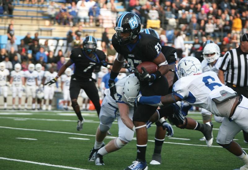 GVL / Robert Mathews
Freshman running back Kirk Spencer (27) speeding past a defender.