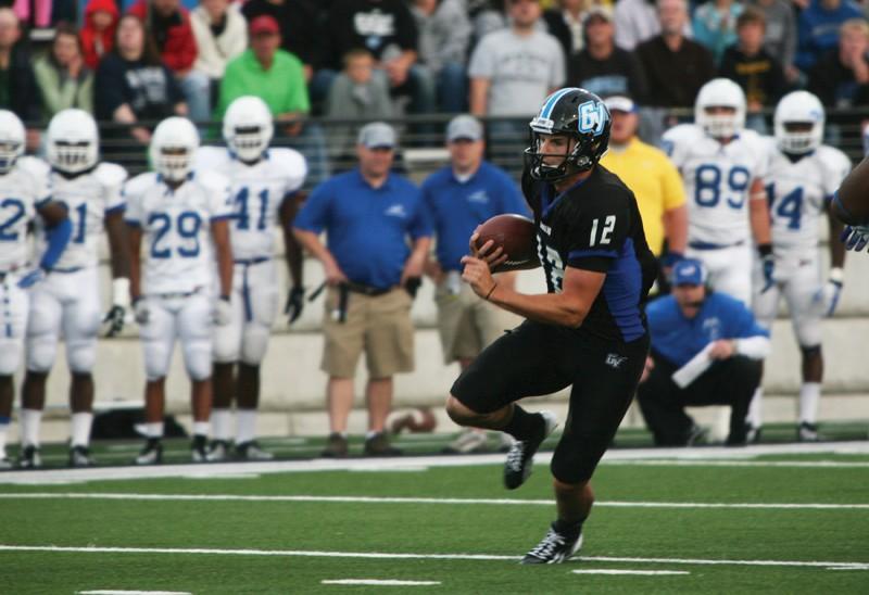 GVL / Robert Mathews
Quarterback Heath Parling (12) running the ball past defenders. 