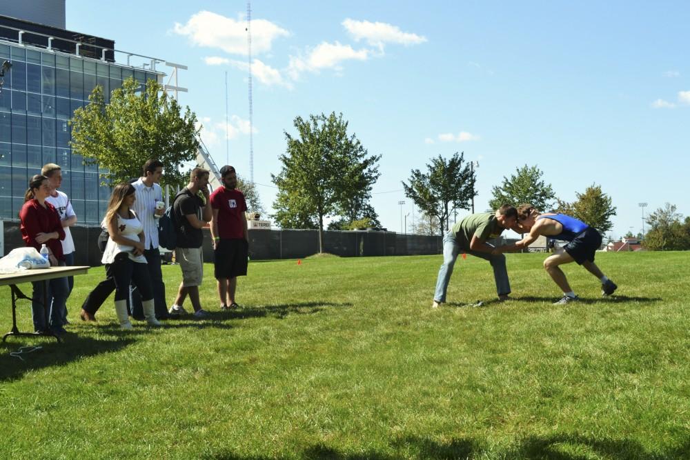 GVL/Mikki Fujimori Jarrod Trombley and Gabe Unick face off in a Roman Wrestling Demonstration during the Paleo Olympics.