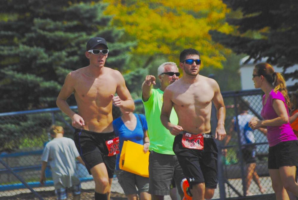 Courtesy Photo/Joe Kargula and Erik Peterson run the Marathon leg of the Ironman Triathlon