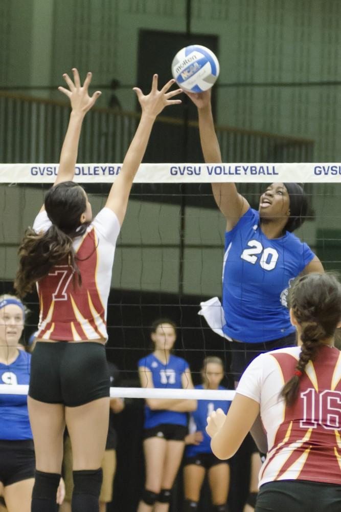 GVL/Bo Anderson GVSU's Eno Umoh spikes the ball early in Friday's first game.