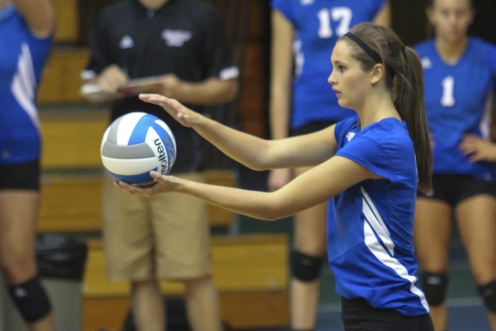 GVL / Jessica Hollenbeck Betsy Ronda prepares to serve the ball during the game on Friday afternoon.