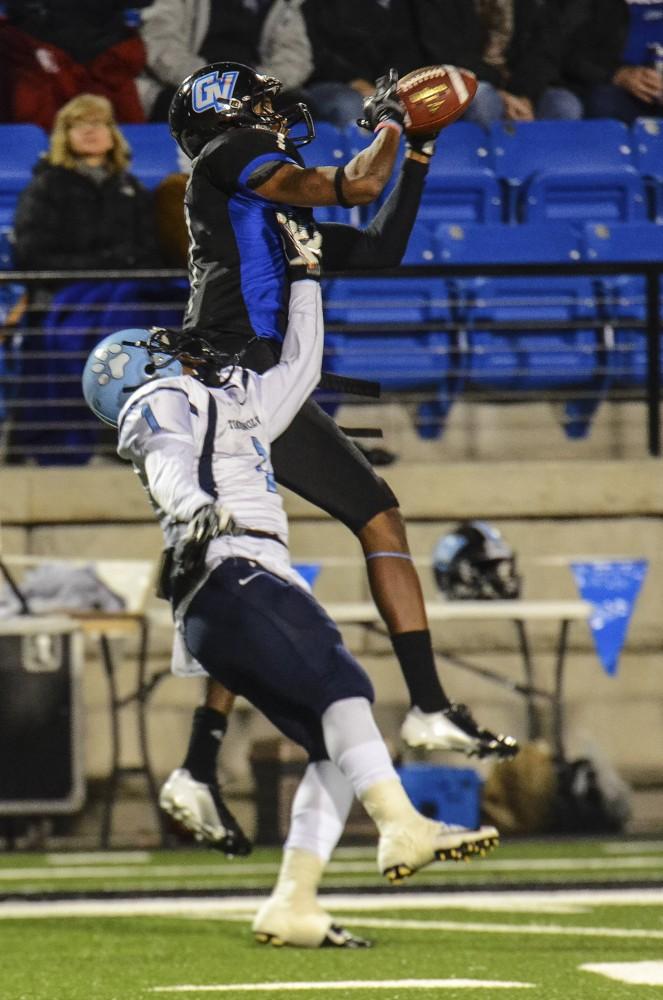GVL/Bo AndersonIsrael Woolfork leaps and makes a a spectacular sideline grab on Saturday night.