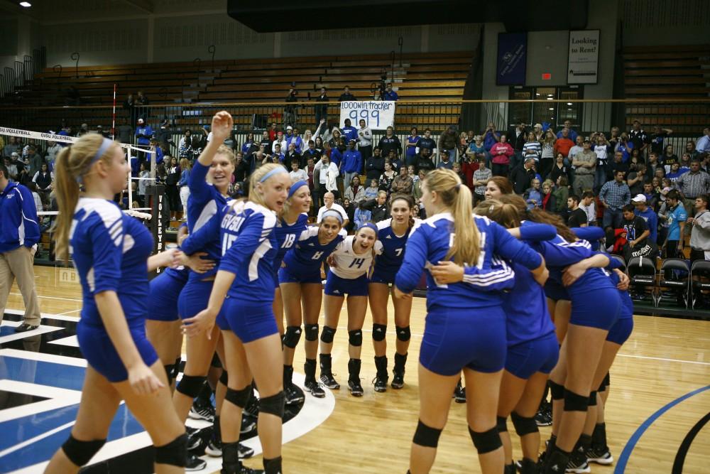 GVL / Eric CoulterThe Lady Lakers celebrate their victory over Lake Erie. The win was the 1,000 win for the Womens Vollyball Team