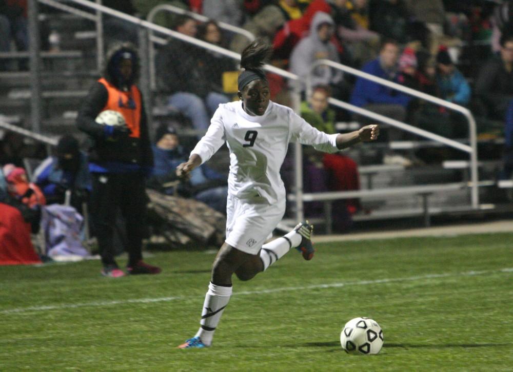 GVL / Eric CoulterJuane Odendaal keeps the ball away from a Rockhurst defender