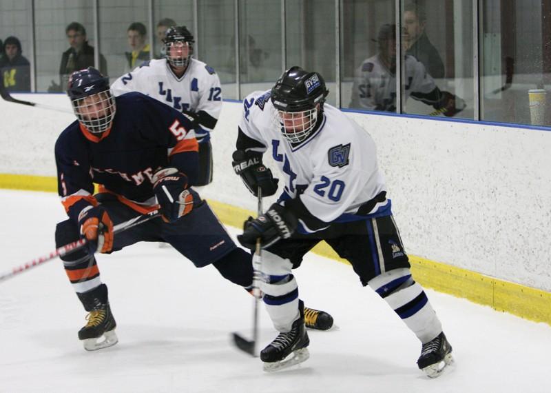 GVL / ArchiveMatt Smartt (20) shooting the puck away from a defender during a previous game against Hope College